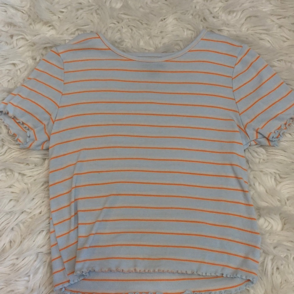 Light blue and orange striped t-shirt, a little cropped, ruffles on the sleeves